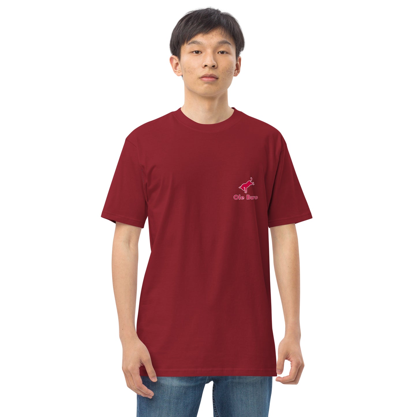 Person wearing a red t-shirt with a logo on a white background