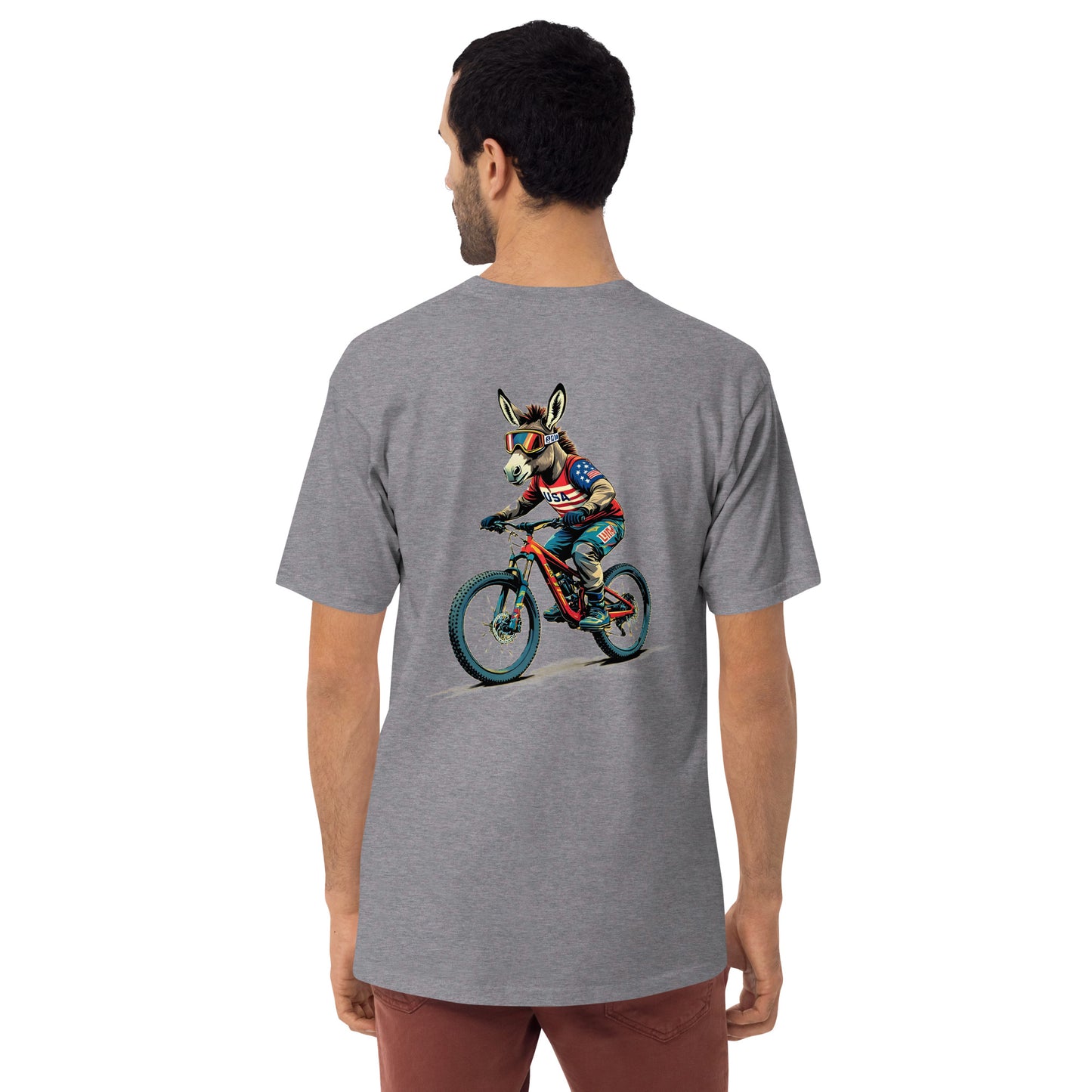 Person wearing a gray t-shirt with a colorful graphic of a donkey riding a bike on the back.
