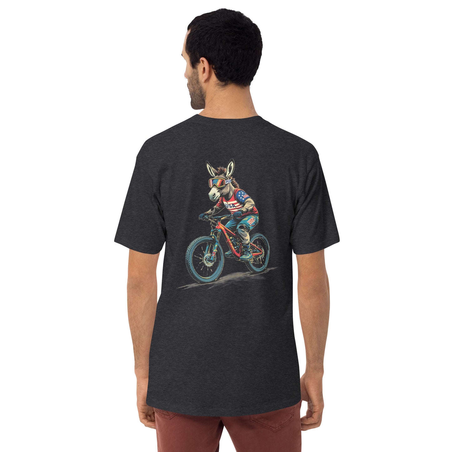 Man wearing a black t-shirt with a colorful graphic of a donkey riding a bike on the back.