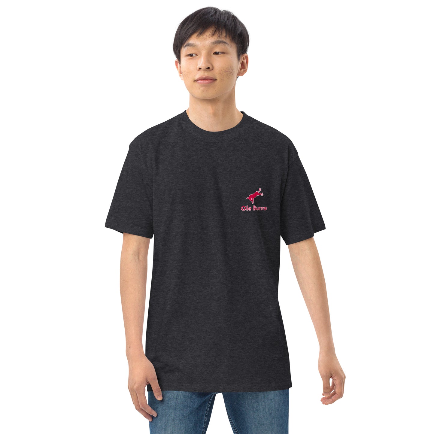 Person wearing a black t-shirt with a pink logo on a white background