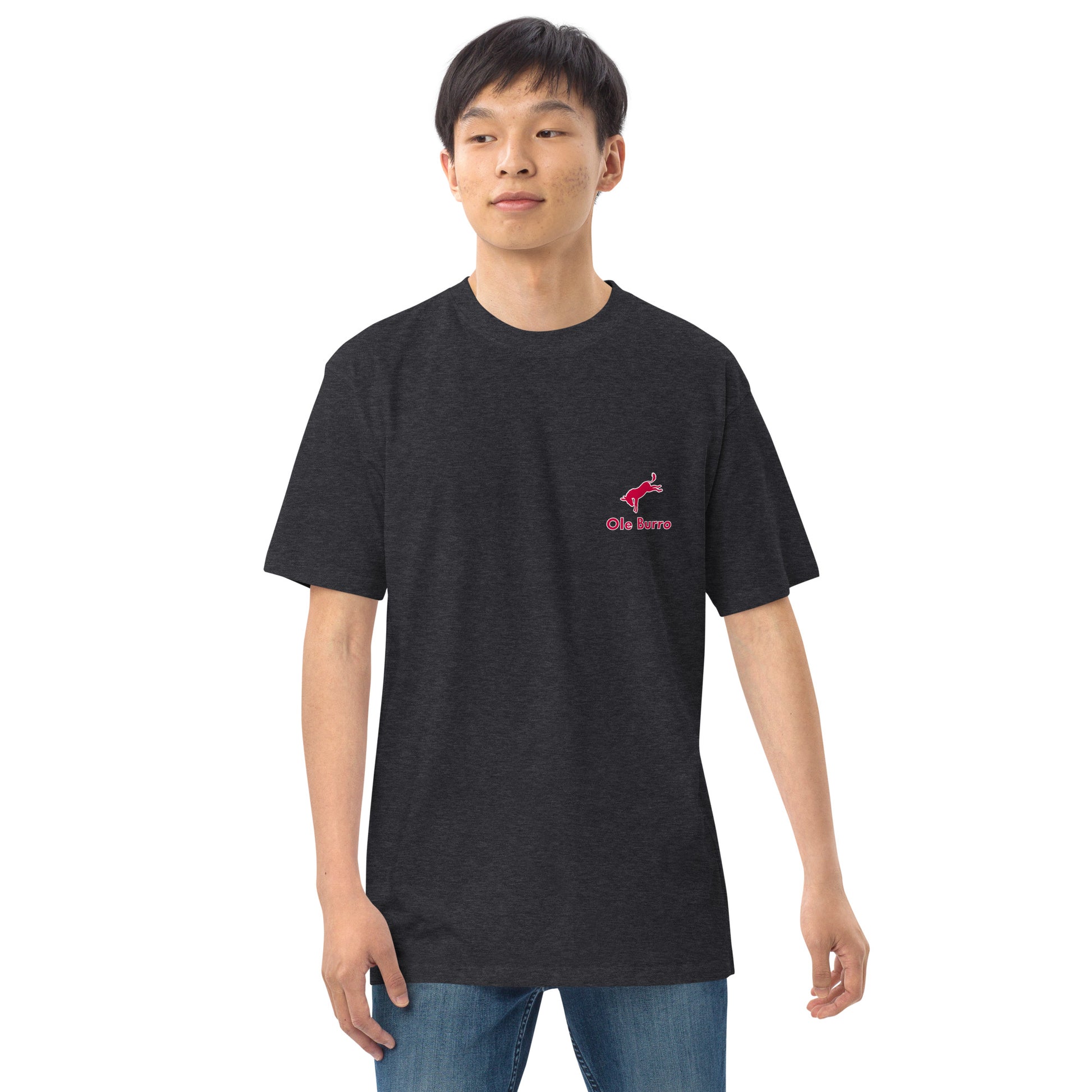Person wearing a black t-shirt with a pink logo on a white background