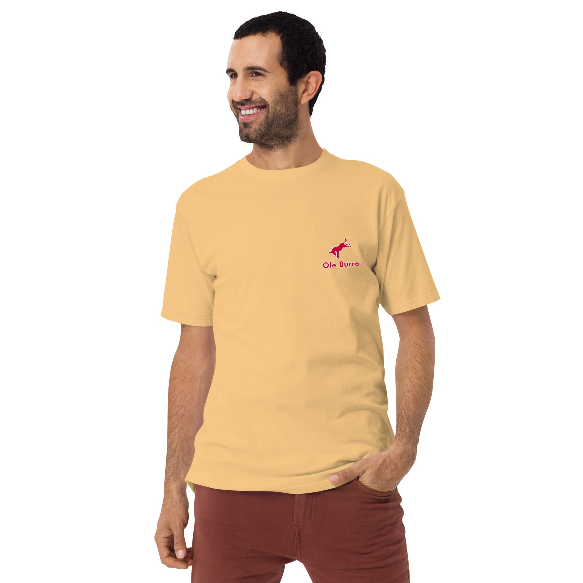 Man wearing a yellow t-shirt with a logo on a white background