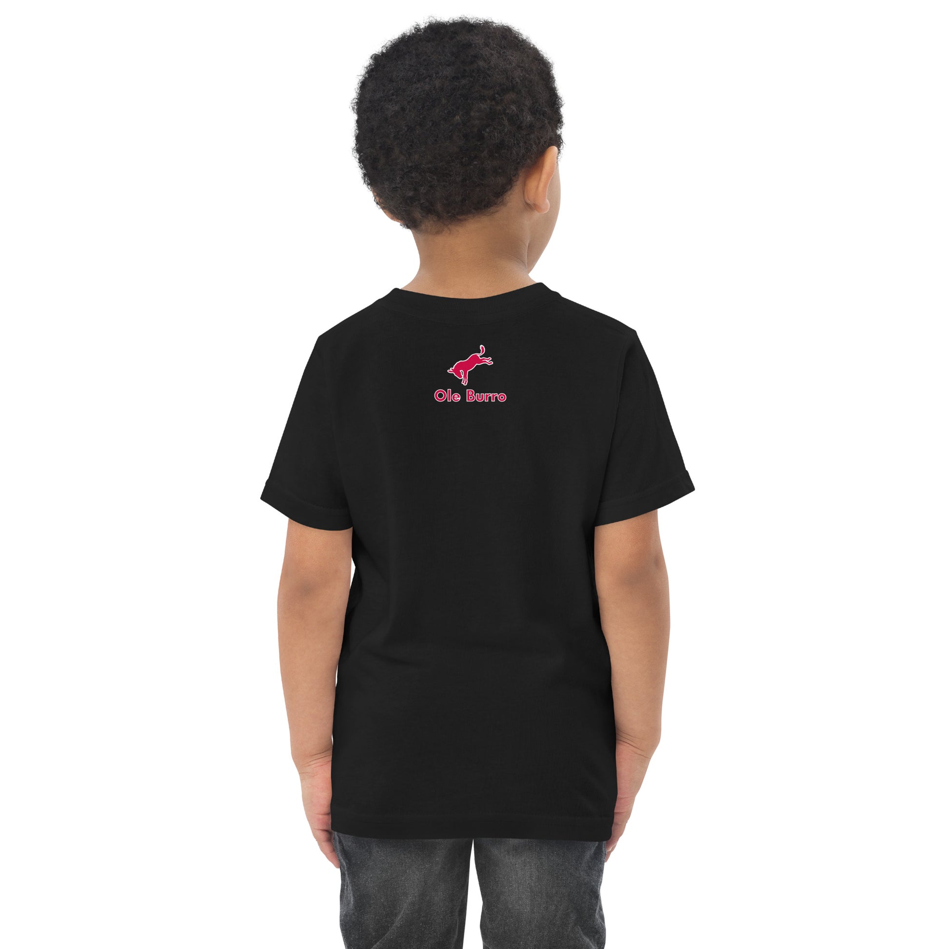 Child wearing a black t-shirt with a logo on the back against a white background