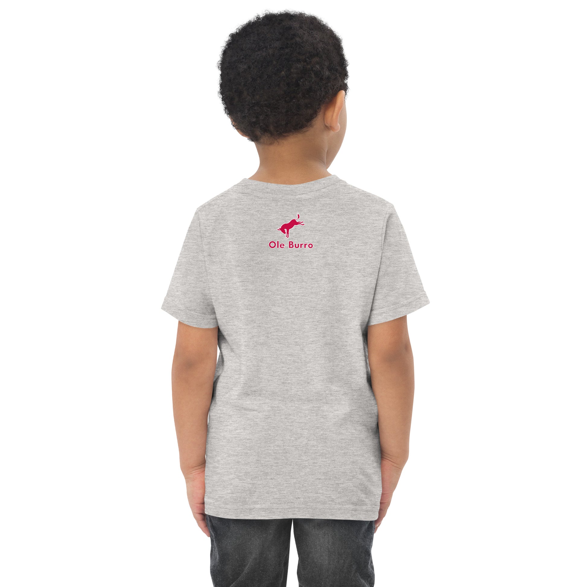 Child wearing a gray t-shirt with a red logo on the back against a white background