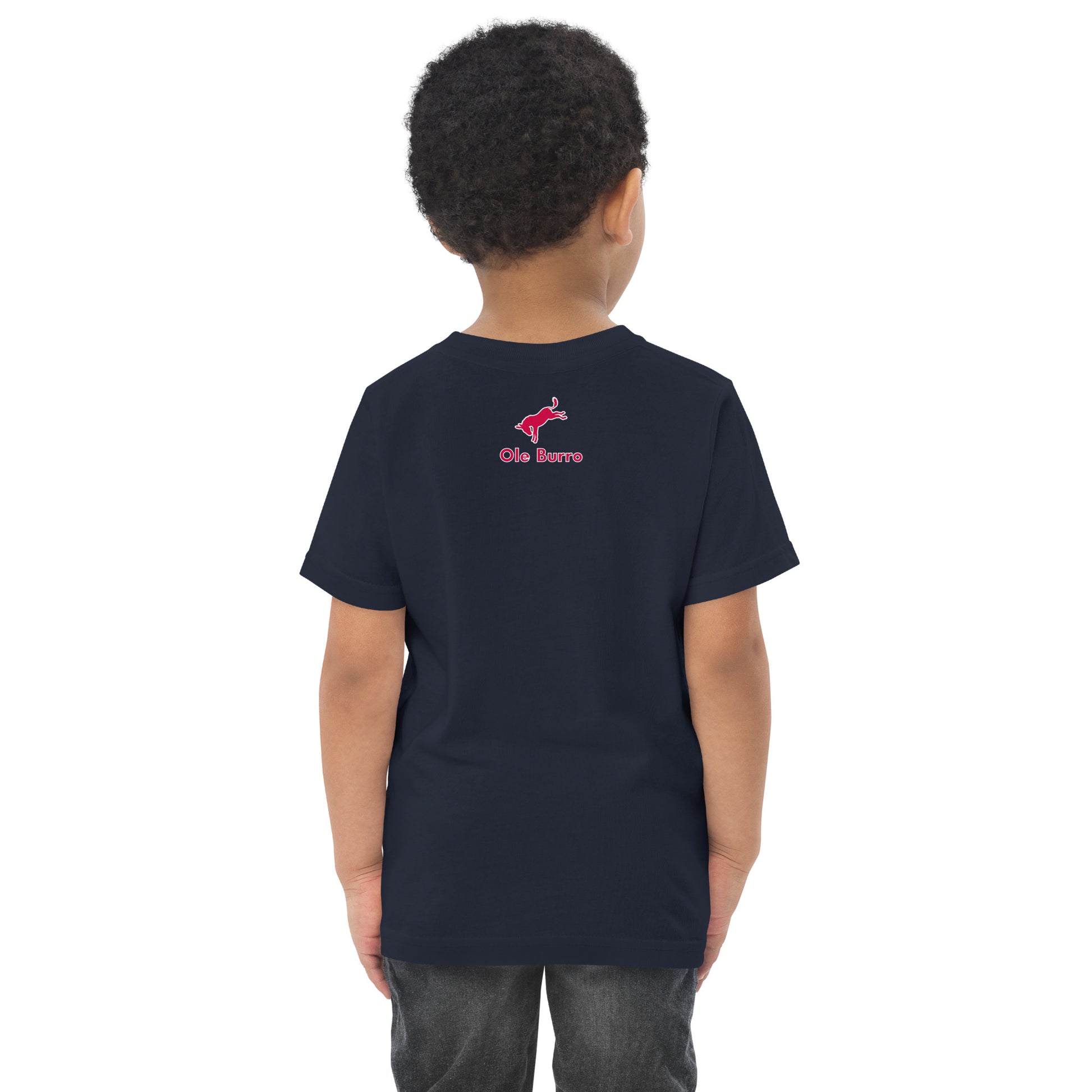 Child wearing a black t-shirt with a red logo on the back against a white background