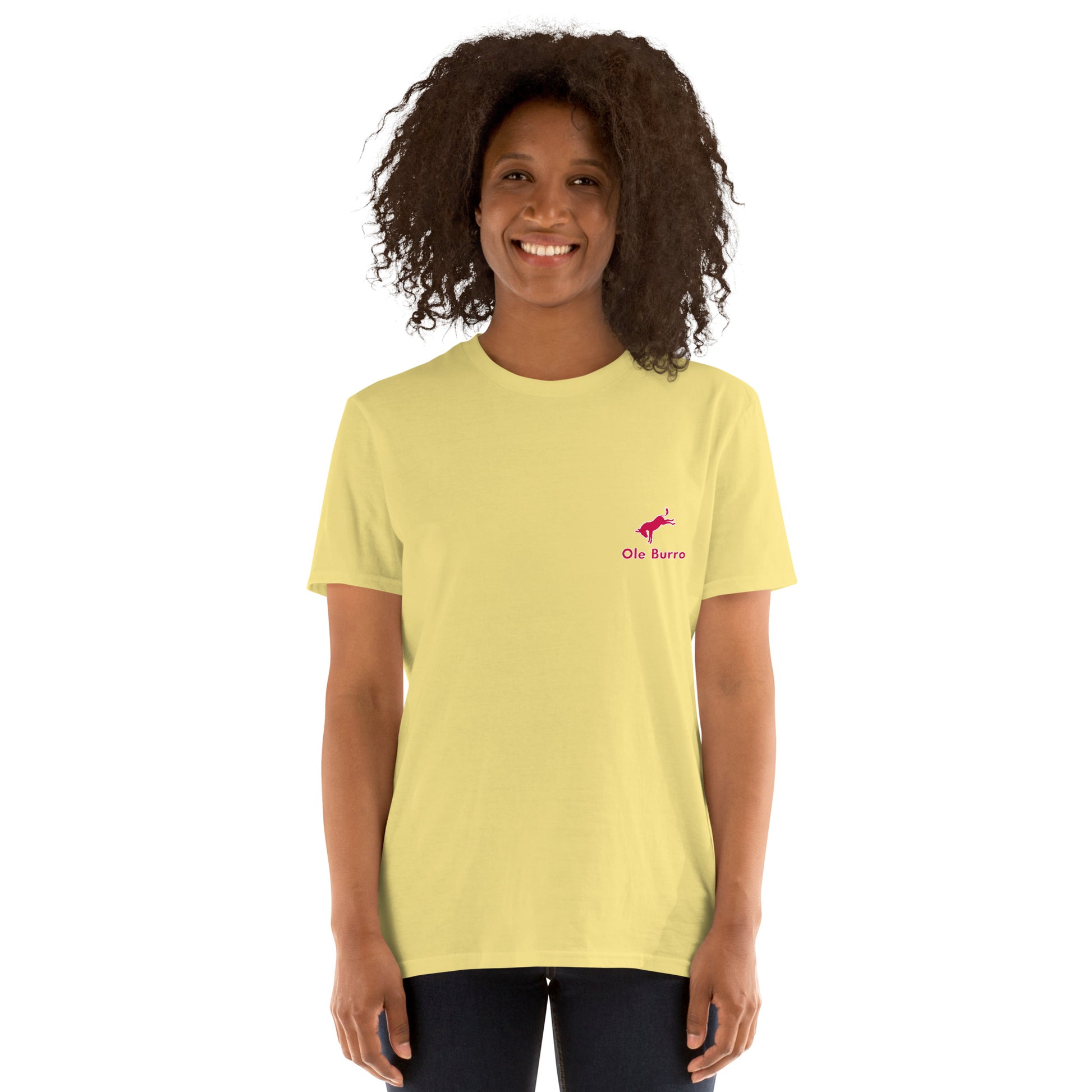Person wearing a light yellow t-shirt with a logo on a white background