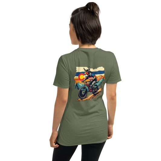 Person wearing a green t-shirt with a graphic design on the back, standing against a white background