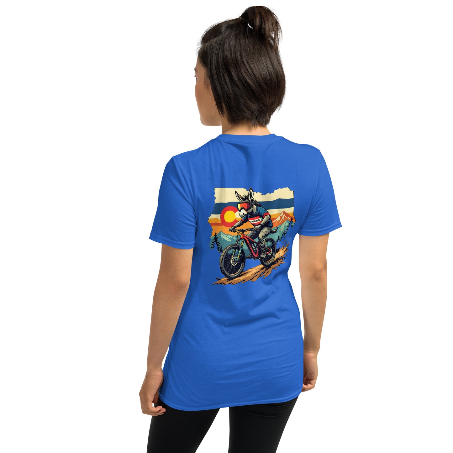 Person wearing a blue t-shirt with a graphic of a motorcycle and sunset on the back