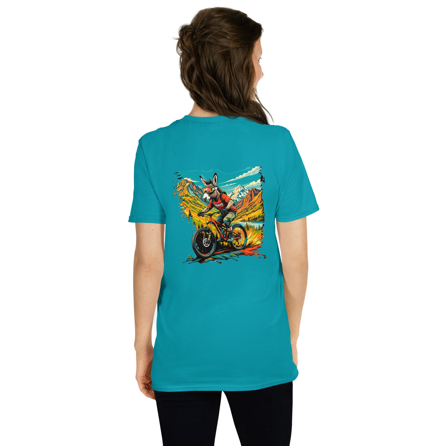 Person wearing a turquoise t-shirt with a graphic design on the back, standing against a white background.