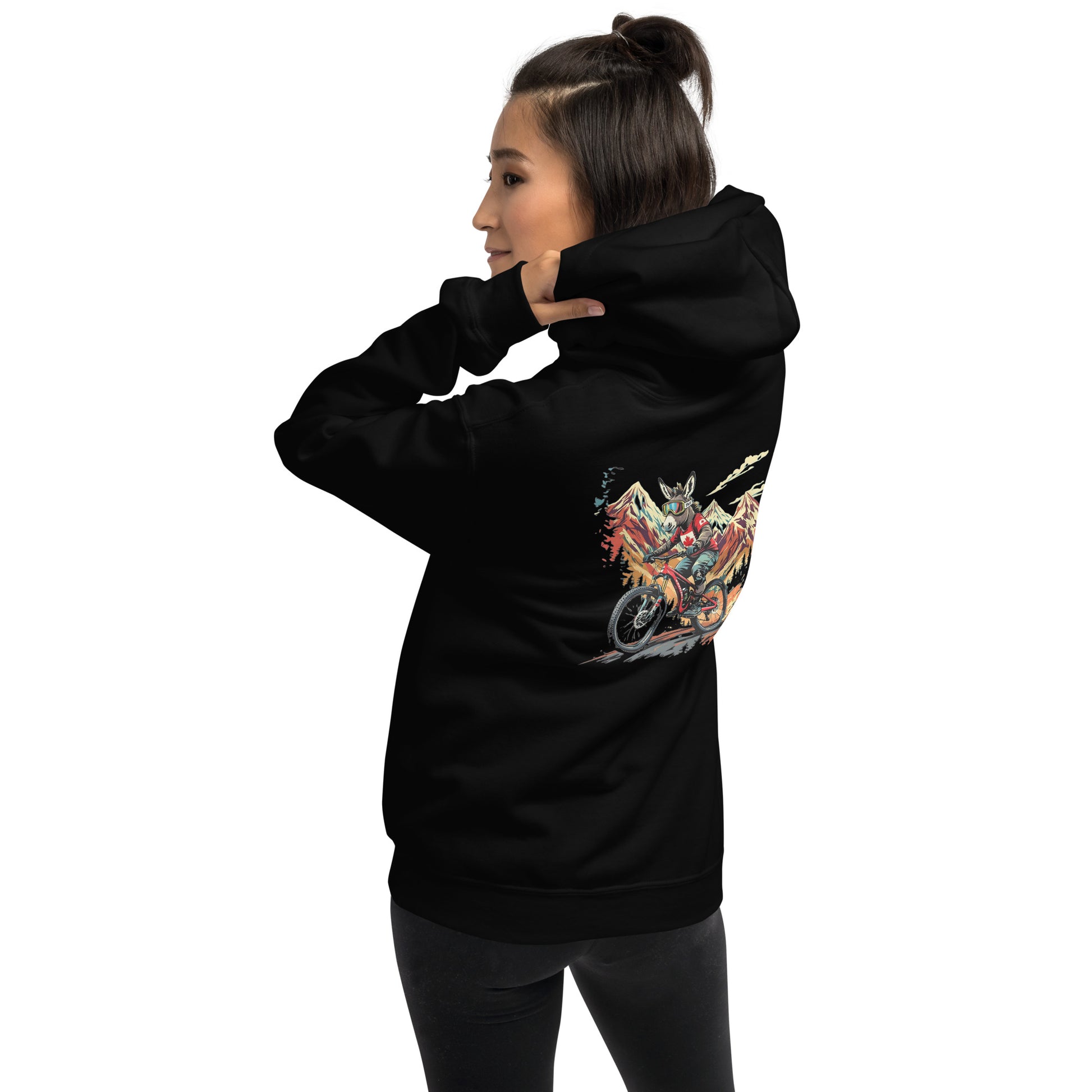 Person wearing a black hoodie with a colorful graphic on the back against a white background