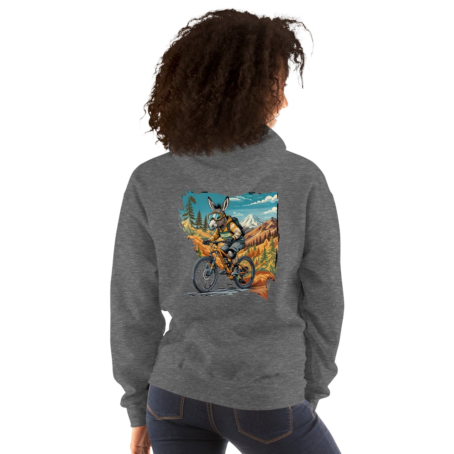 Person wearing a gray hoodie with a colorful graphic on the back, standing against a white background