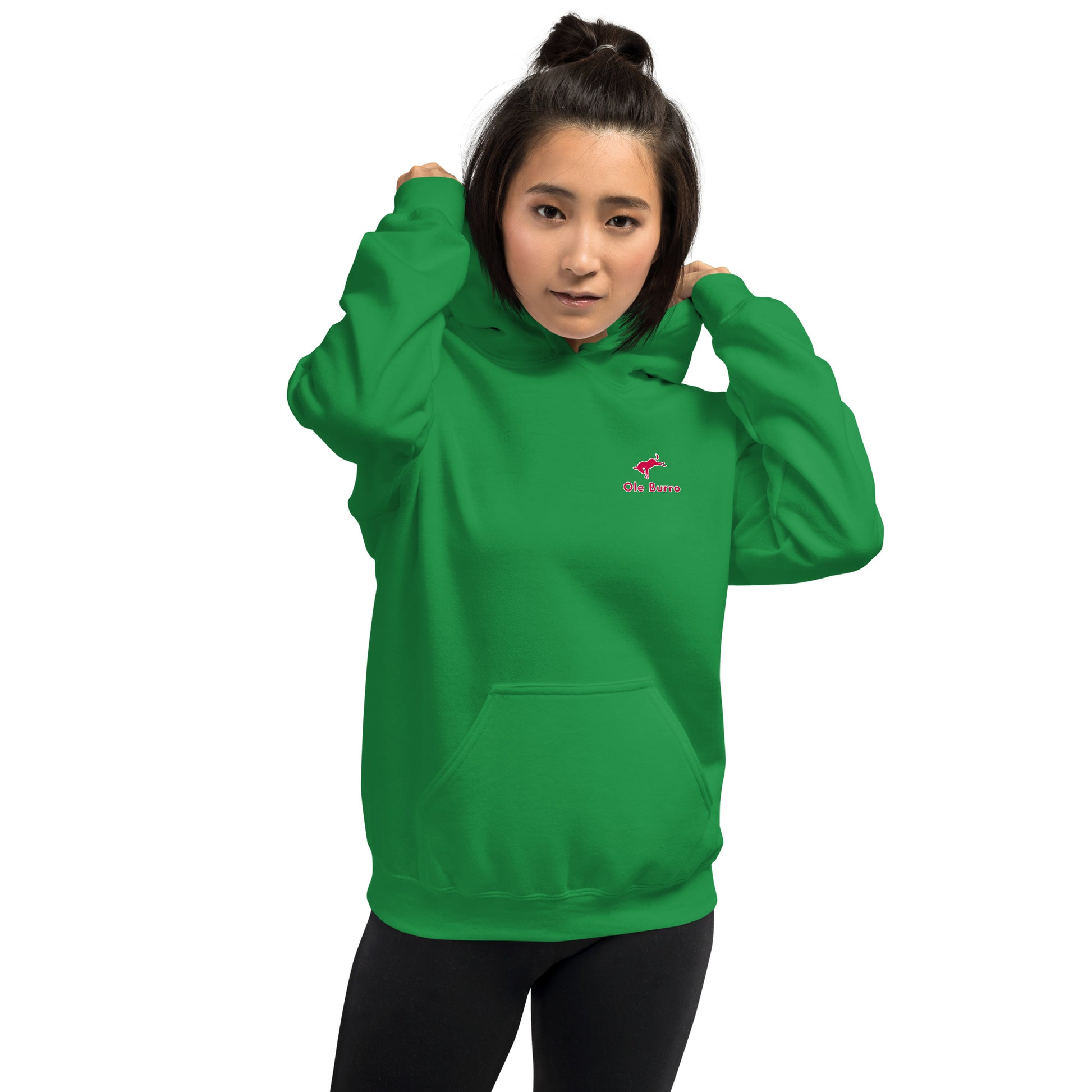 Person wearing a green hoodie with a small logo on a white background
