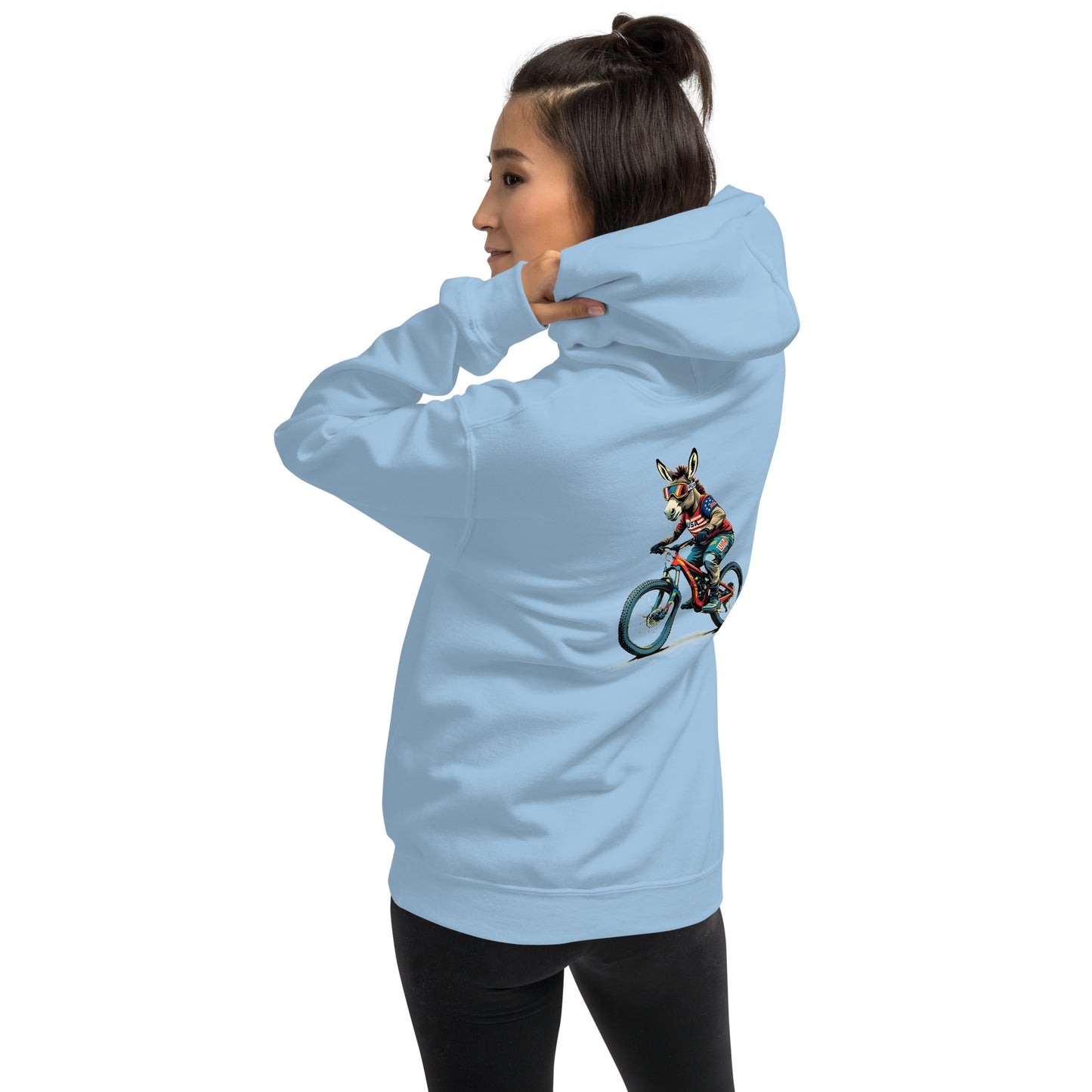 Light blue hoodie with a graphic of a person on a bike on the back, worn by a person.