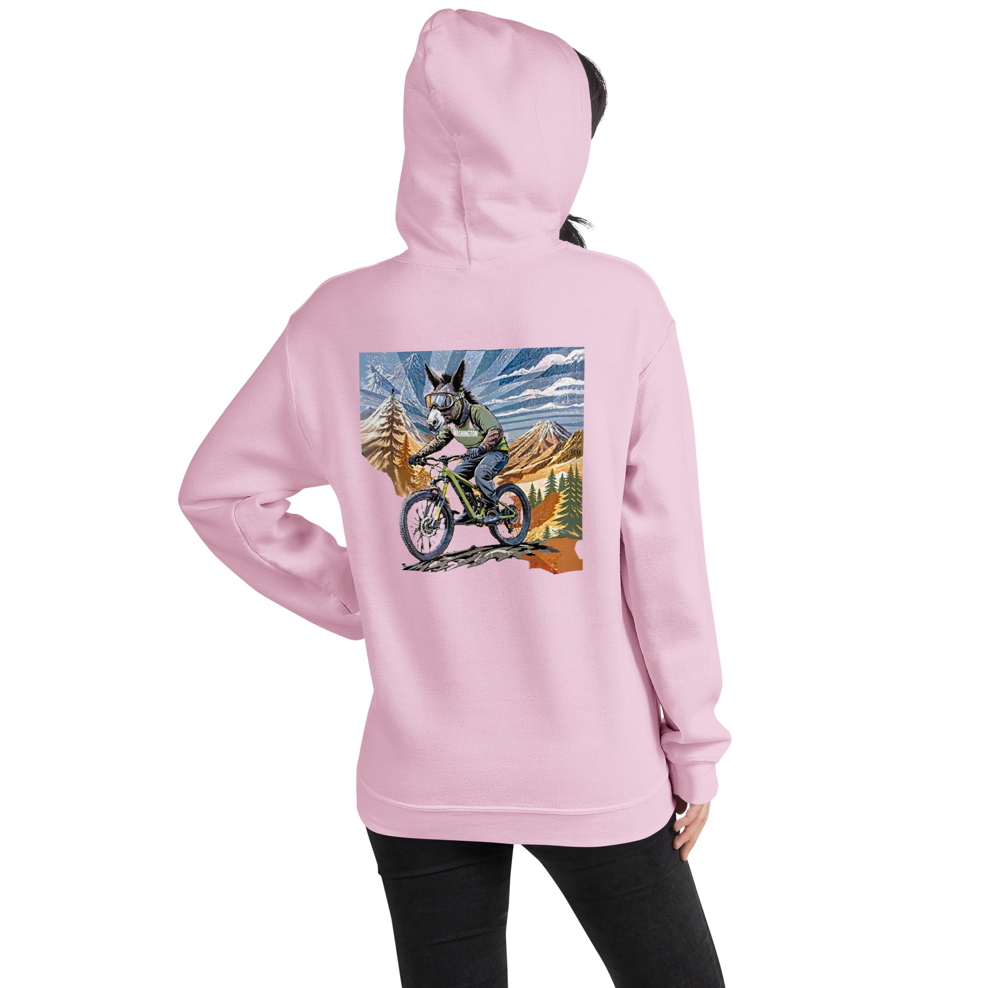 Pink hoodie with a graphic of a person on a bike in a mountainous landscape on the back.