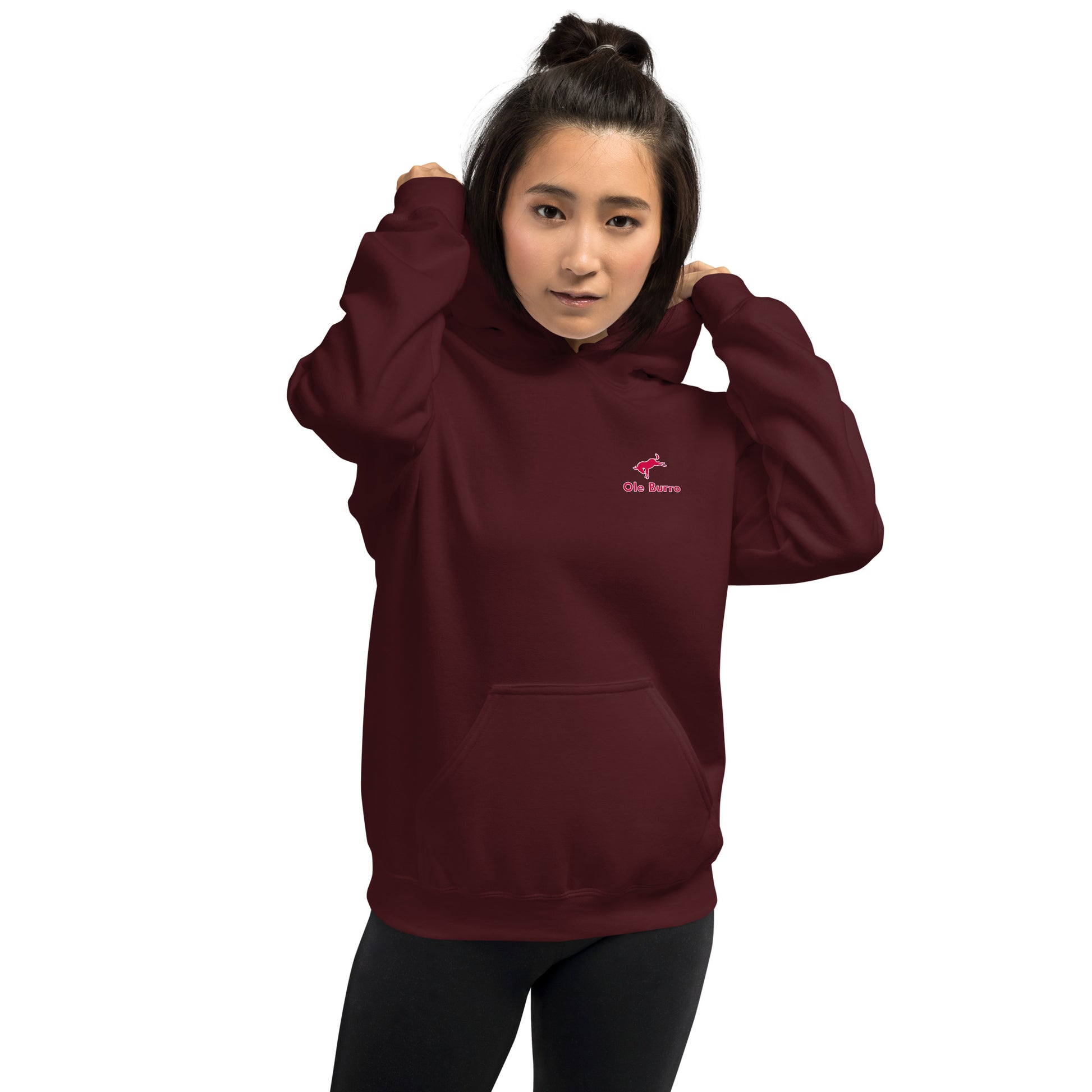 Person wearing a maroon hoodie with a logo on a white background