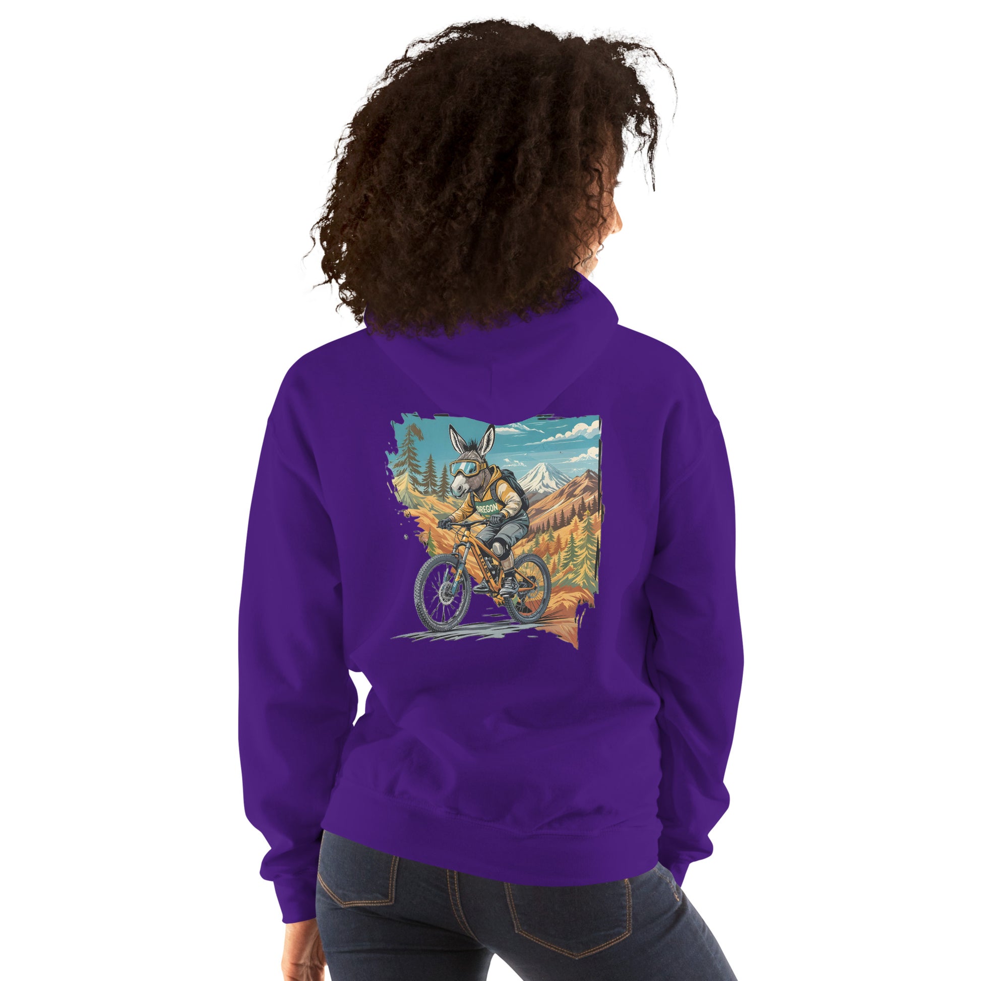 Person wearing a purple hoodie with a colorful graphic on the back, standing against a white background