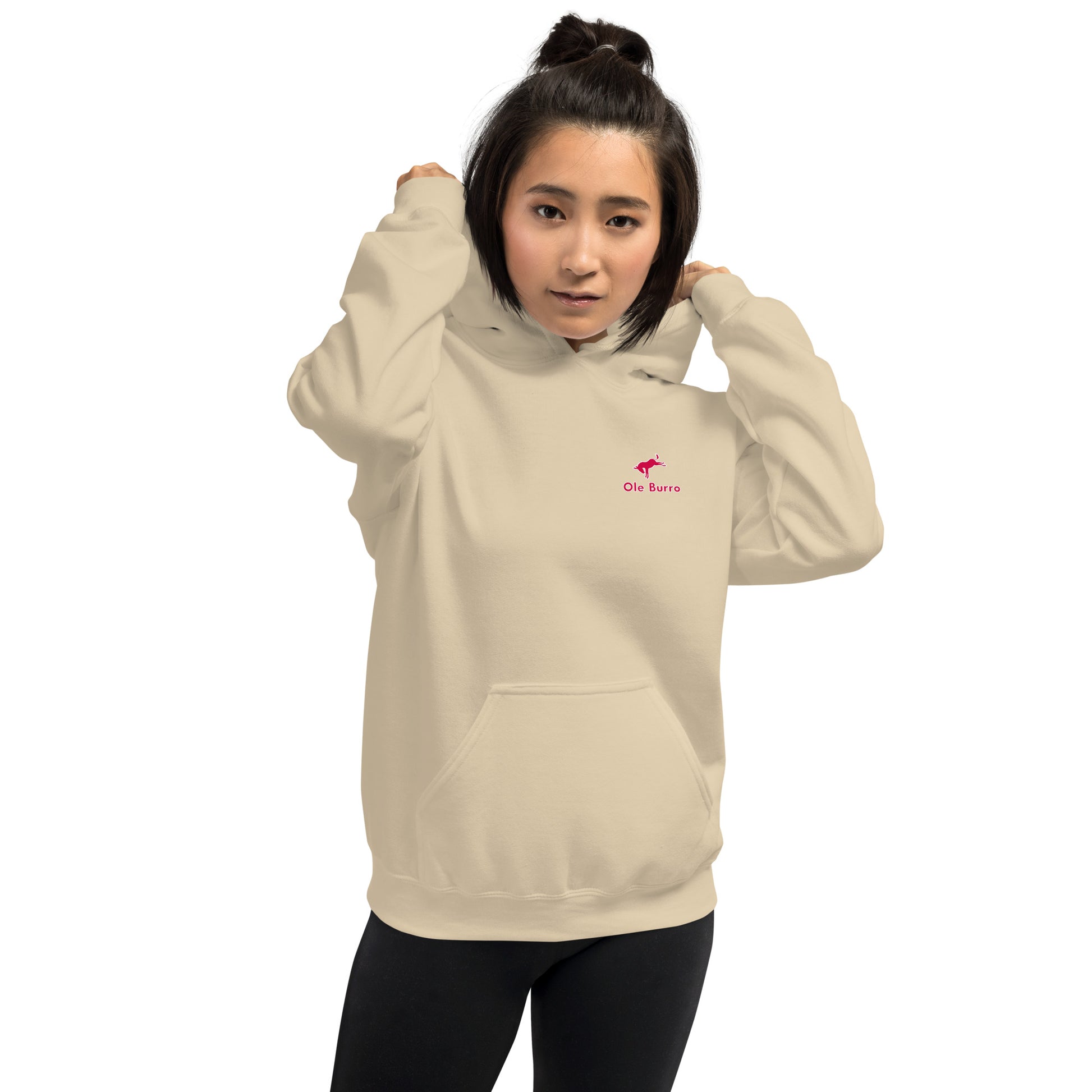 Person wearing a beige hoodie with a logo on a white background
