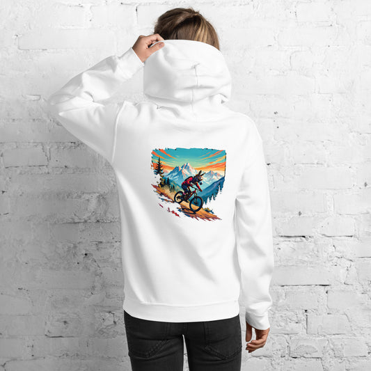 Person wearing a white hoodie with a colorful graphic on the back against a white brick wall.