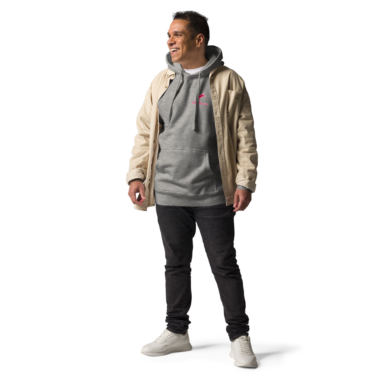 Man wearing a gray hoodie with a pink logo, beige jacket, black pants, and white shoes on a white background
