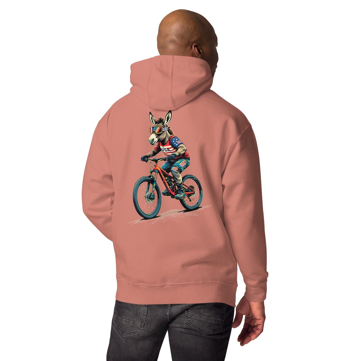 Person wearing a pink hoodie with a graphic of a dog riding a bike on the back.