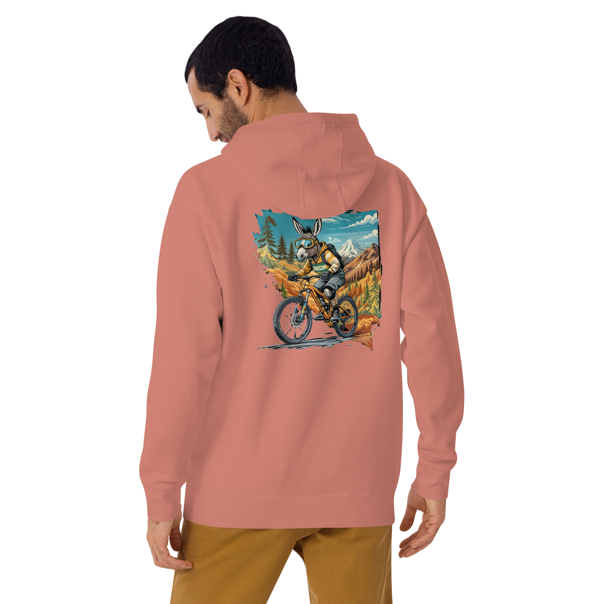 Person wearing a pink hoodie with a colorful graphic on the back, standing against a white background