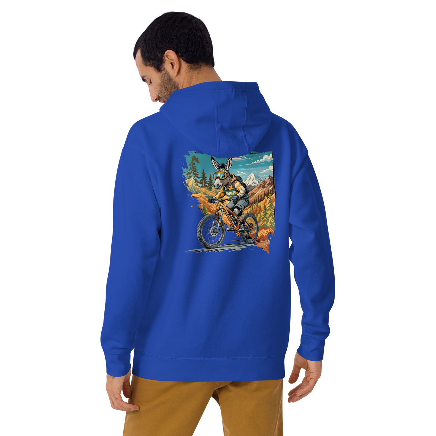 Man wearing a blue hoodie with a graphic design on the back, standing against a white background