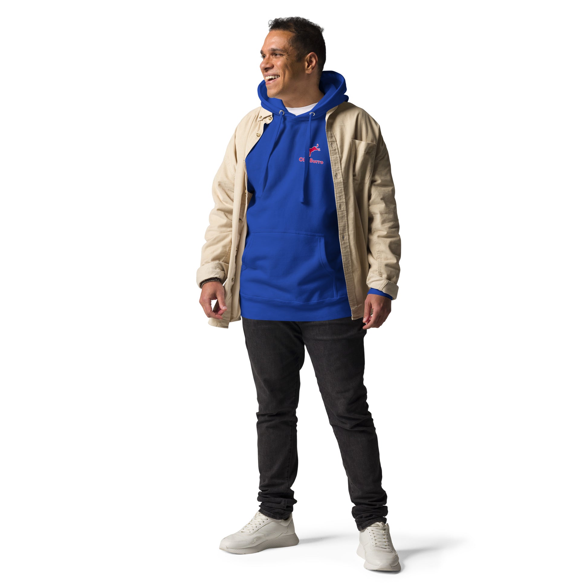 Man wearing a blue hoodie with a logo and beige jacket on a white background