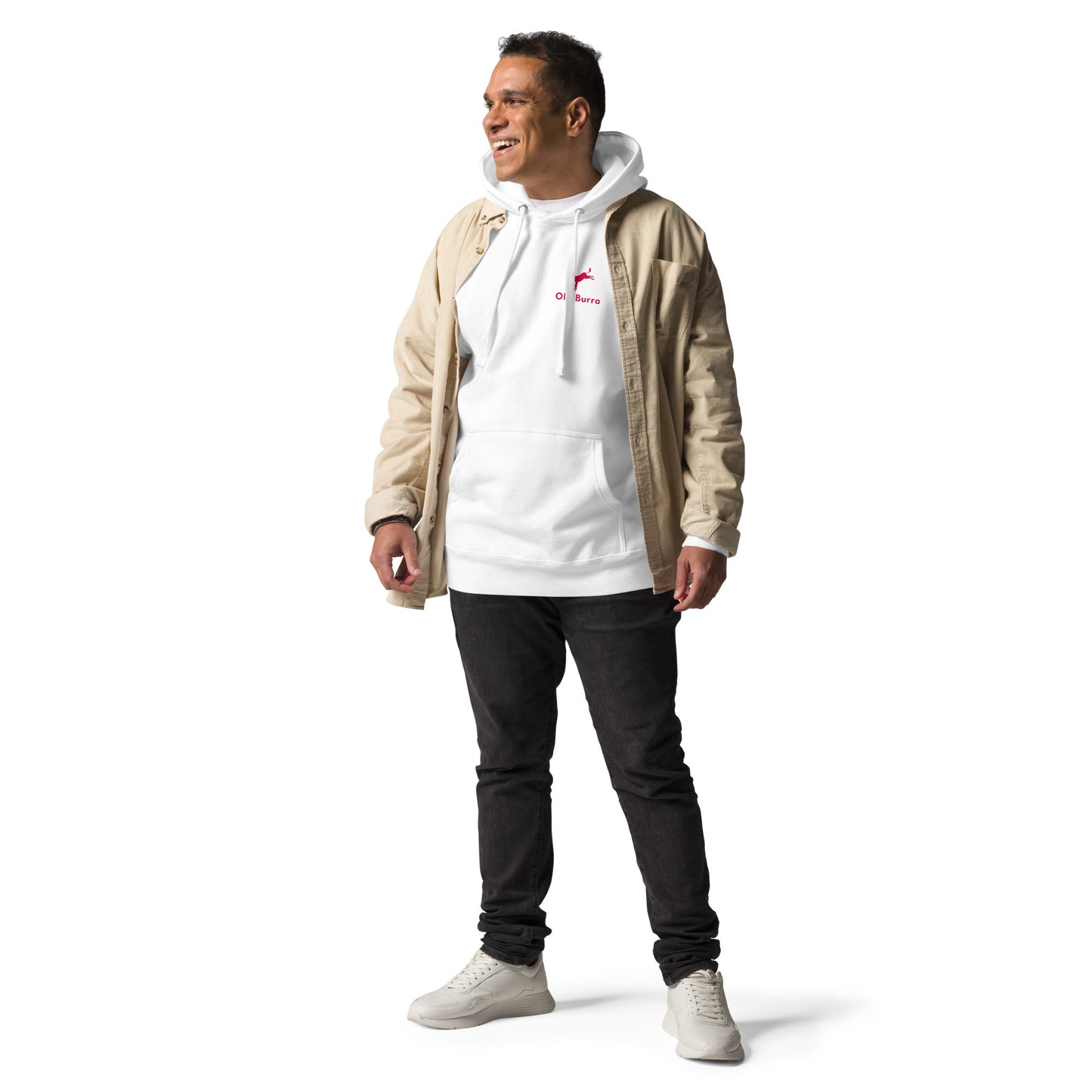 Man wearing a beige jacket over a white hoodie with a logo, black pants, and white sneakers on a white background