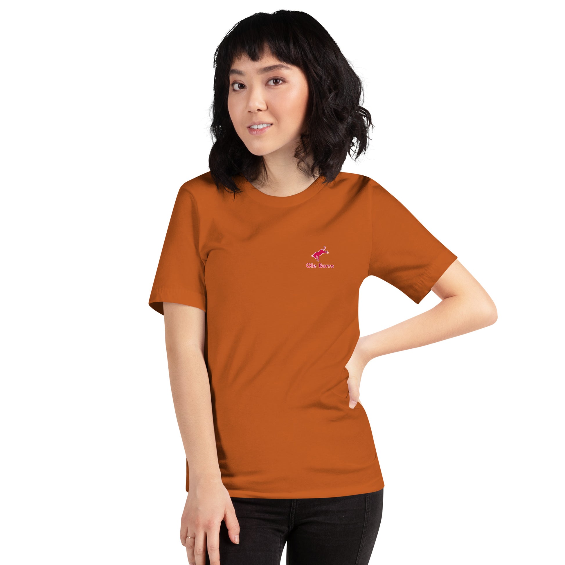 Person wearing an orange t-shirt with a logo on a white background