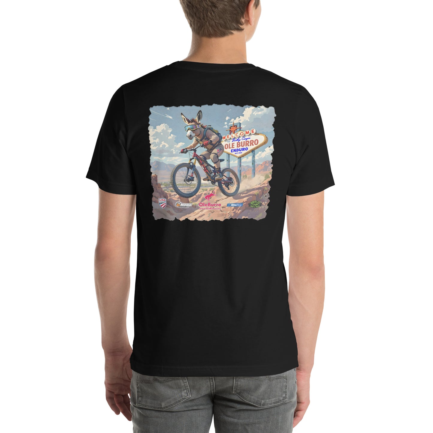 Black t-shirt with a graphic design on the back, featuring a person riding a bike and a sign.