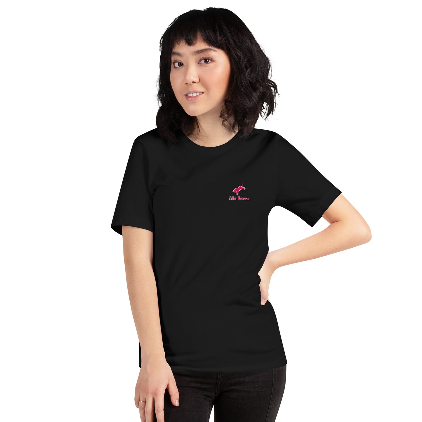 Person wearing a black t-shirt with a pink logo on a white background