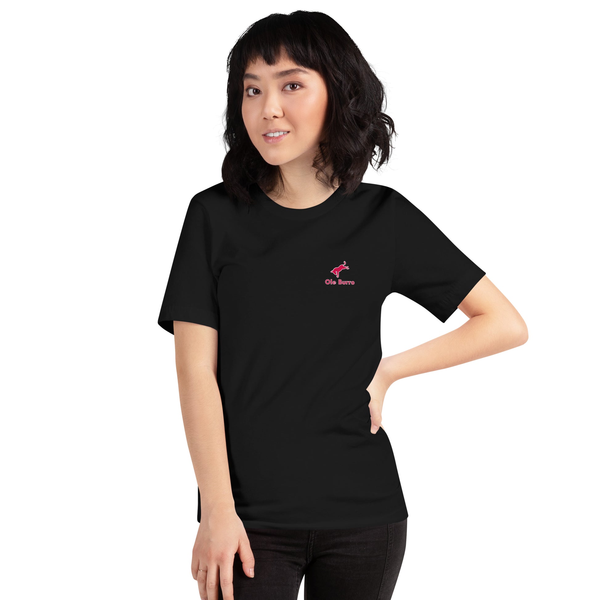 Person wearing a black t-shirt with a pink logo on a white background