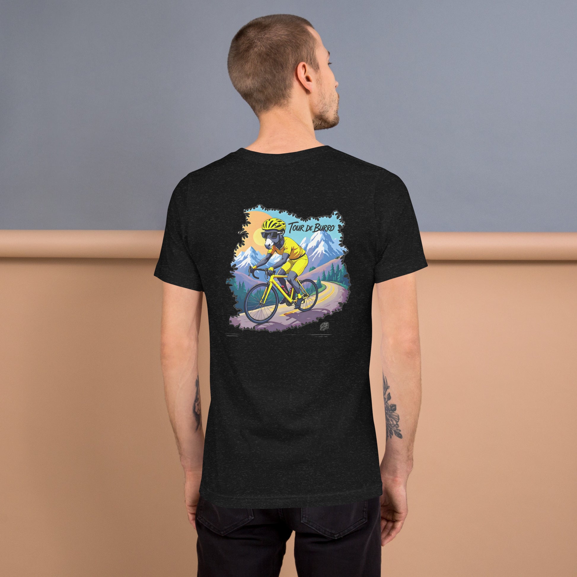 Man wearing a black t-shirt with a colorful graphic on the back, standing against a plain background.