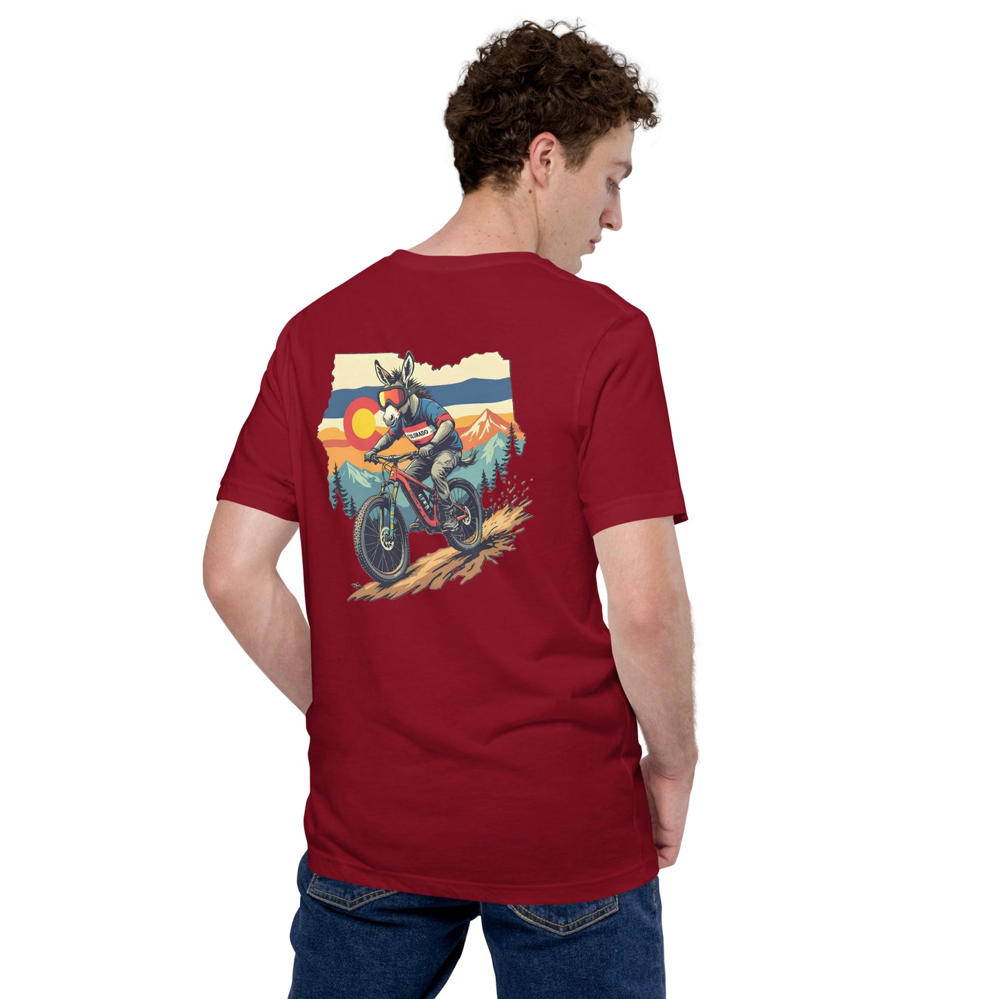 Person wearing a red t-shirt with a graphic of a motorcycle on the back, standing against a white background.