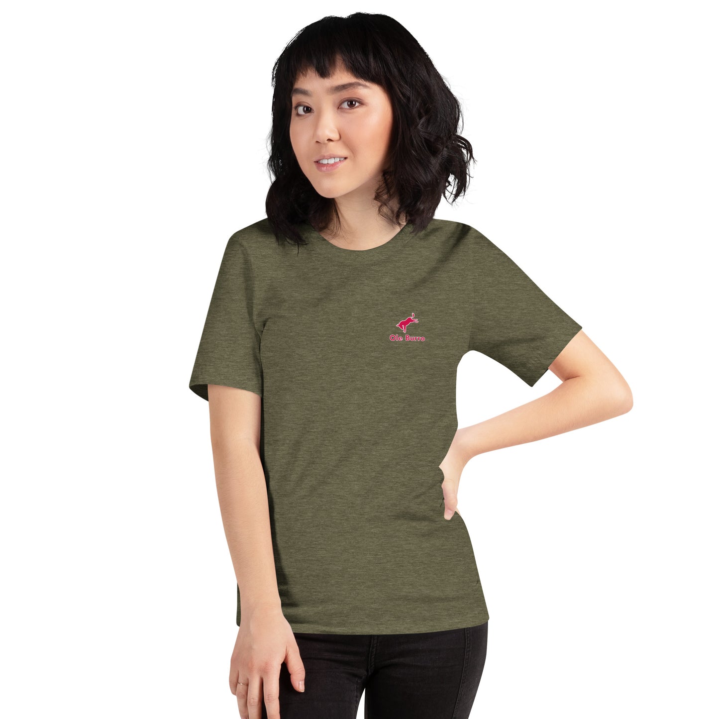 Person wearing a green t-shirt with a small logo on a white background