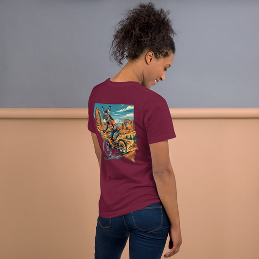 Person wearing a maroon t-shirt with a colorful graphic on the back, standing against a neutral background.