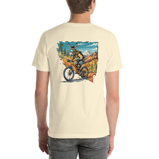 Person wearing a cream t-shirt with a graphic of a moose riding a bike in a mountainous landscape.