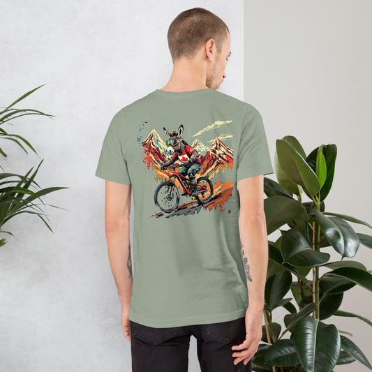 Person wearing a green t-shirt with a colorful graphic on the back, standing against a light gray wall with plants.