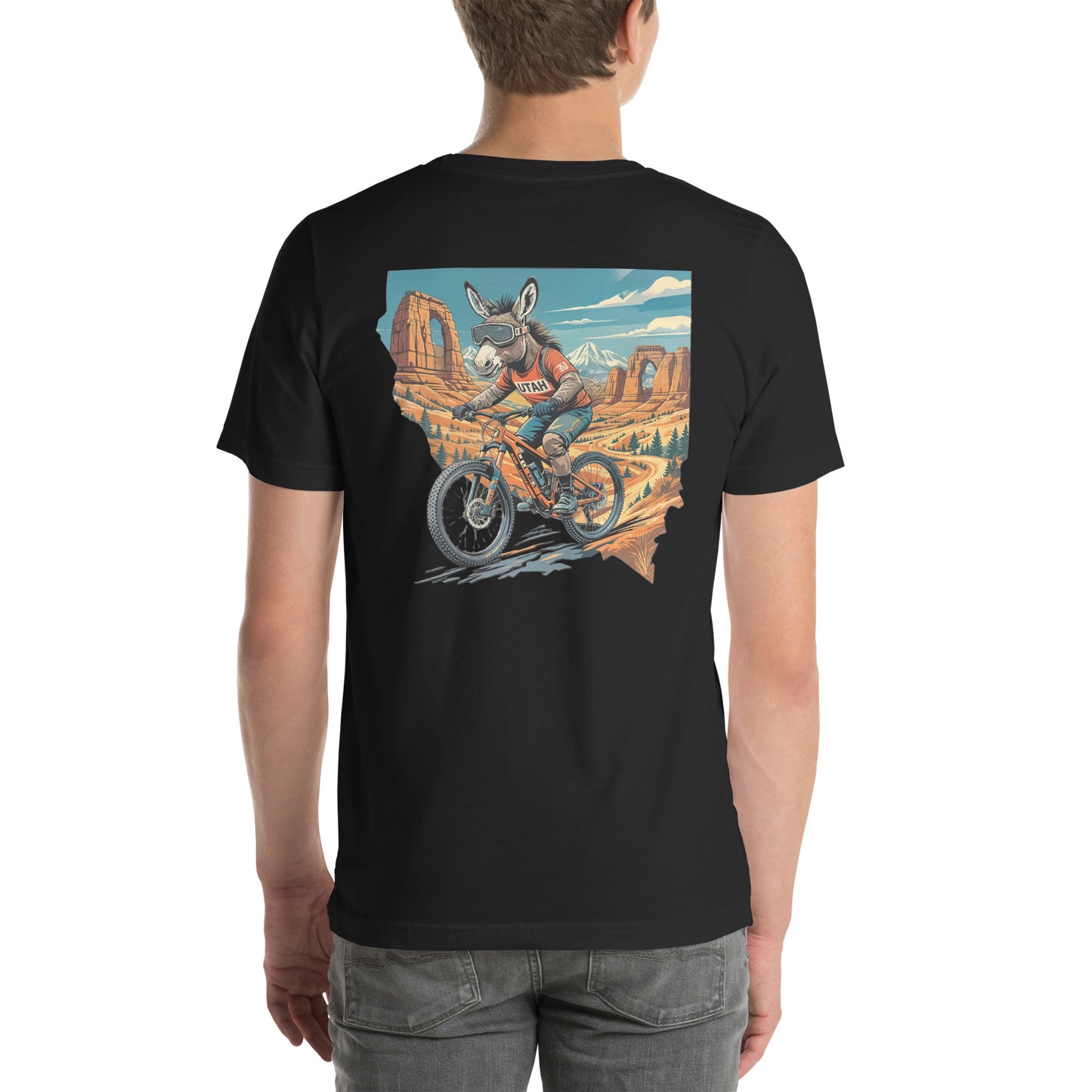 Black t-shirt with a graphic of a person riding a motorcycle in the desert on a white background