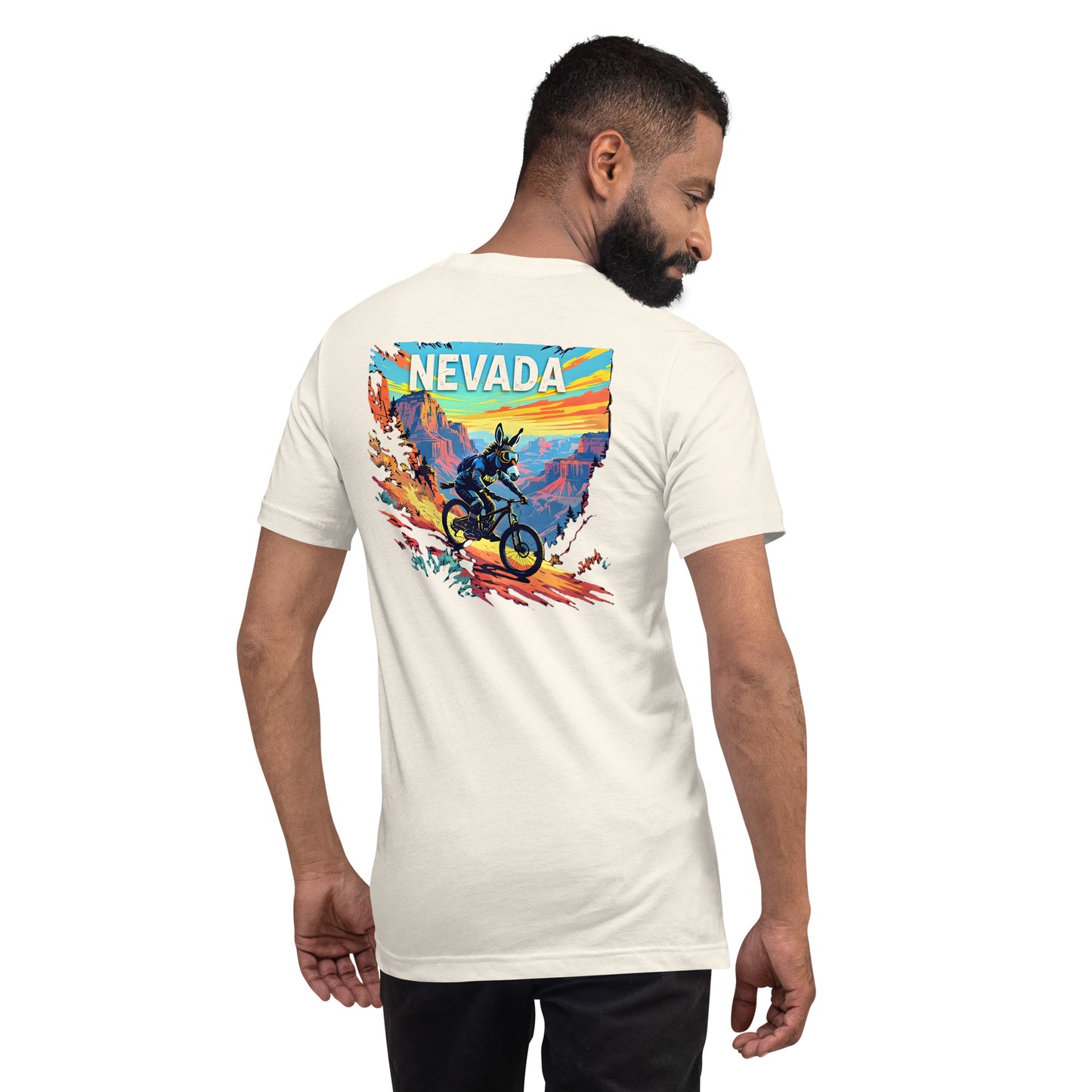 Man wearing a white t-shirt with a colorful 'NEVADA' graphic on the back.