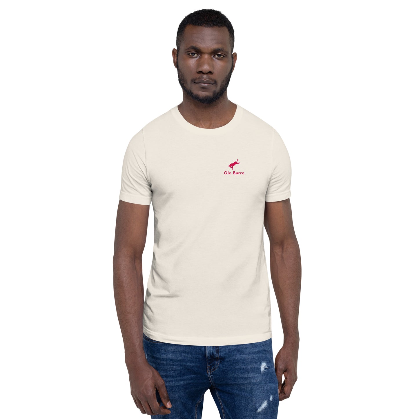 Man wearing a beige t-shirt with a red logo on a white background